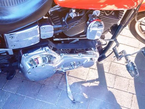 Closeup motorcycle engine side reflective metal. Light tinting Stock Photos