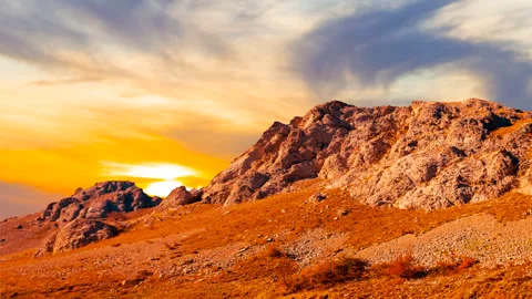 Closeup mount slope at the red dramatic sunset time lapse scene Stock Footage 288064402