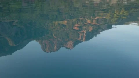 Closeup of mountain reflection in the sea Stock Footage 138234633