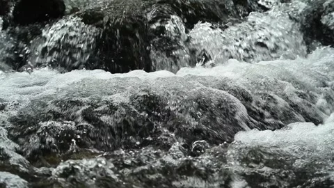 Closeup of a mountain stream, slow motion Stock-Footage 288149902