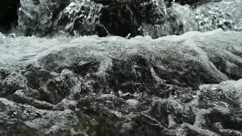 Closeup of a mountain stream, slow motion Stock Footage 288149907