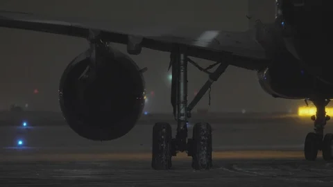 A closeup of a moving airplane engine and chassis Stock Footage 99230586