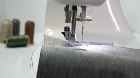 Closeup of moving needle of sewing machine Stock Footage 101035485