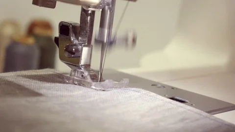Closeup of moving needle of sewing machine Video stock 101035492