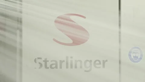 Closeup of moving polymer threads in front of Starlinger logo Stock Footage 203825437