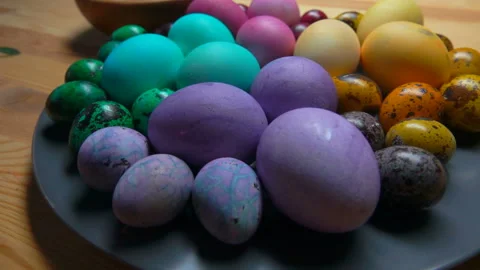 Closeup of multi colored Easter chicken and quail eggs on the grey plate Stock Footage 127643983