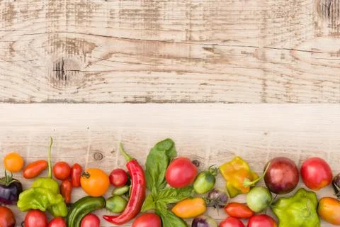 Closeup of multi-colored fresh organic vegetables: paprika, tomatoes, and her Stock Photos