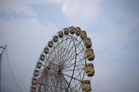 Closeup of multi-coloured Giant Wheel during Dussehra Mela in Delhi, India... Stock Photos