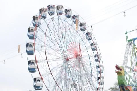 Closeup of multi-coloured Giant Wheel during Dussehra Mela in Delhi, India... Stock Photos