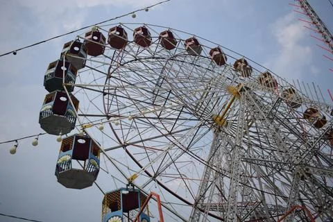 Closeup of multi-coloured Giant Wheel during Dussehra Mela in Delhi, India... Stock Photos