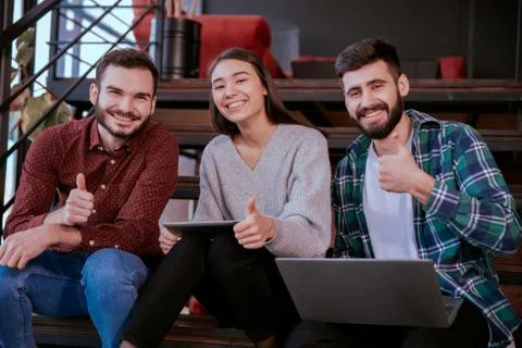 Closeup multiethnic students analyzing happy and excited their project for the Stock Photos