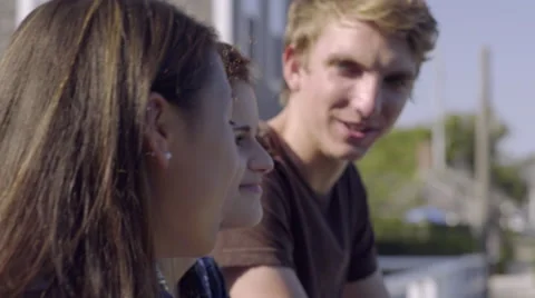 Closeup Of Multiethnic Teens Chatting On A Bridge And Enjoying View Stock Footage 57375732