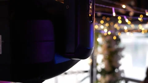 Closeup of a multitude of multicolored spotlights on the ceiling in a restaurant Stock Footage 334941534