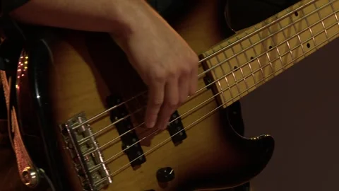 Closeup: Musician plays five string electric jazz bass on stage gig Stock Footage 339864771
