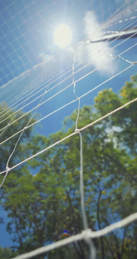 Closeup of net with sun and blue sky  abstract outdoor background Vidéo 327853714