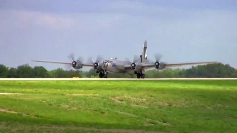 Closeup next to the runway of World War II B-29 Superfortress bomber taking off Stock-Footage 147163791