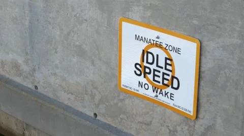Closeup of No Wake Manatee Zone boating sign, 4K Stock Footage 50144716