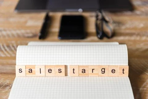 Closeup on notebook over wood table background, focus on wooden blocks Stock Photos