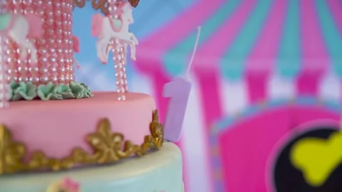 Closeup of number 1 candle on pink birthday cake Stock Footage 265446397