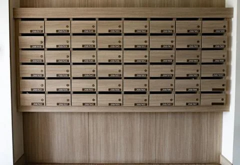 Closeup of numbered mailboxes and lockers in raw in the condo. Stock Photos