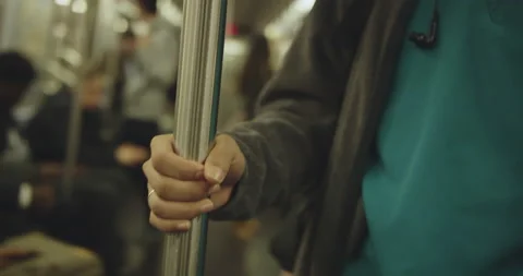 Closeup of nurses hand on subway Stock Footage 130231444