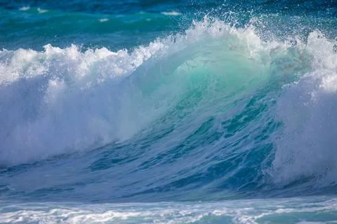 Closeup on the ocean wave begins to form. Stock Photos