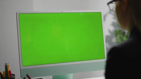 Closeup office green desktop computer. Freelancer surfing web checking report 스톡 사진