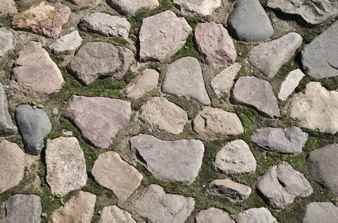 Closeup of old cobblestone pavement surface Closeup of old cobblestone pav... 스톡 사진