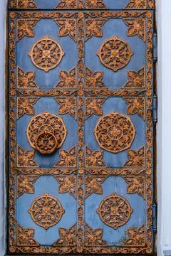 Closeup of the old door with fancy pattern Stock Photos