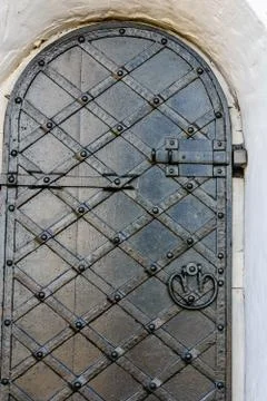 Closeup of the old door with fancy pattern Stock Photos