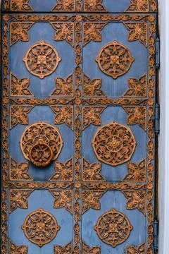 Closeup of the old door with fancy pattern Stock Photos
