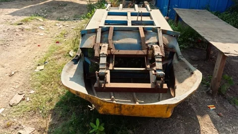 Closeup of an old rusty boat or car chassis lying on the ground abandoned o.. Stock Footage 265207451