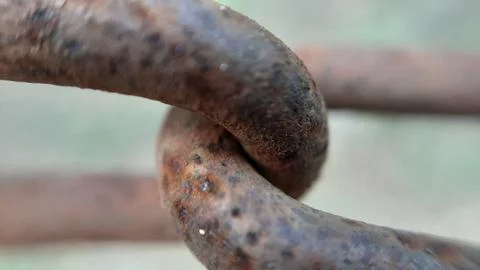 Closeup of old rusty interlinked chains Stock Photos