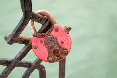 Closeup of a old rusty padlock on the bridge Stock Photos