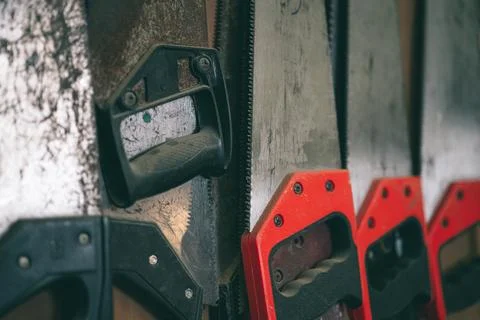 Closeup old used rust hand saw sharp teeth for heavy duty wood cut home diy.. Stock Photos