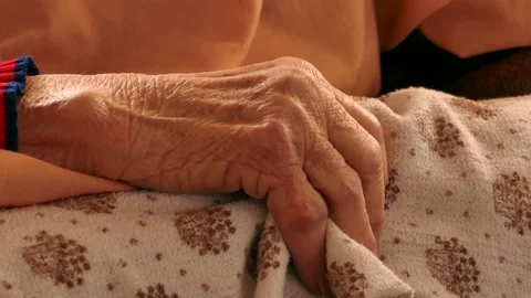 Closeup Of Old Woman’s Hand Lying In Bed In Need Of Care Stock Footage 137974750