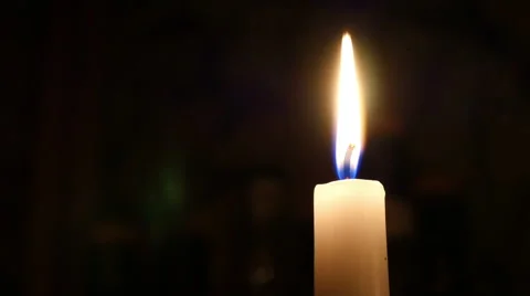 Closeup of one candle on black Video stock 42489641