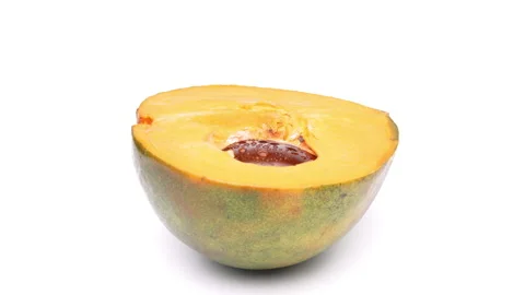 Closeup of one half of lucuma fruit is rotating. Isolated on white background. Stock-Footage 158552580