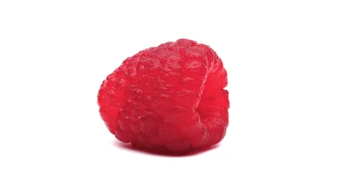 Closeup of one red raspberry with water drops rotating on turntable. Isolated on Stock Footage 157086310