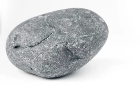 Closeup of one rock on plain background 库存照片