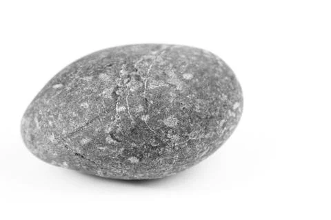Closeup of one rock on plain background Stock Photos