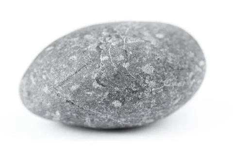 Closeup of one rock on plain background Stock Photos