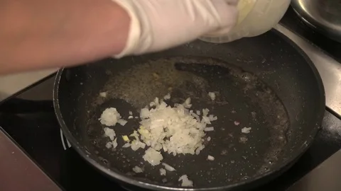 Closeup of onion frying on the pan Stock Footage 77028841