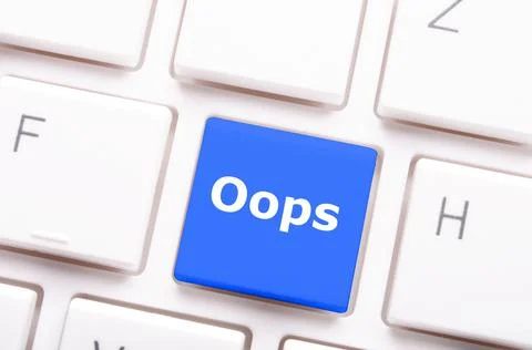 Closeup of a "Oops" button on a computer keyboard - mistake concept Stock Photos