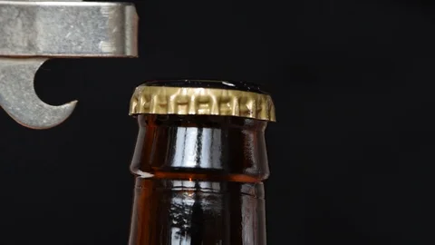 Closeup of open beer bottle on black background 스톡 동영상 105112131