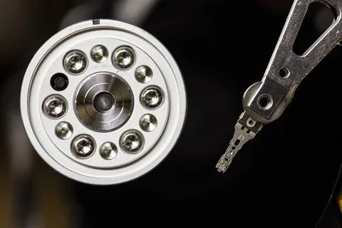  Closeup of an open hard disk drive showing the read/write head and spindl... Stock Photos