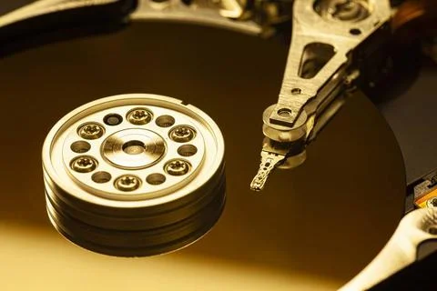  Closeup of an open hard disk drive, highlighting the actuator arm poised ... Stock Photos