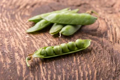 Closeup of an open raw pea Stock Photos