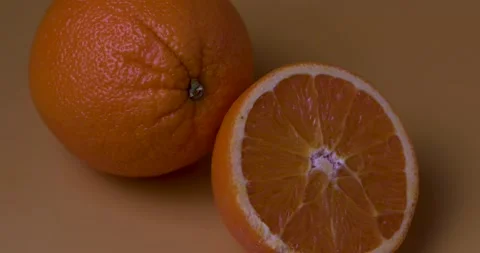 Closeup orange fruit on yellow background 스톡 동영상 172595130