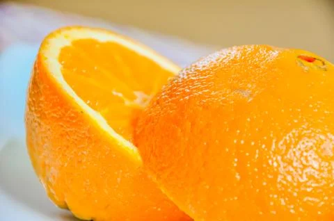 Closeup of orange sliced in half Stock Photos